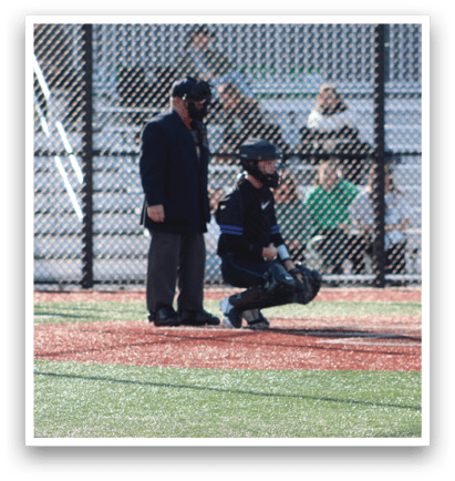 A baseball game is in progress with a batter, catcher, and umpire on the field. The batter is holding a baseball bat, ready to swing. AI generated content