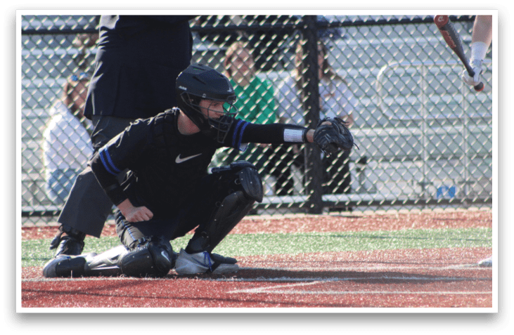A baseball catcher is squatting down, ready to catch the ball. AI generated content