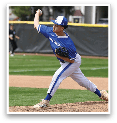 A baseball player in a blue and white uniform is pitching a ball on a field. AI generated content