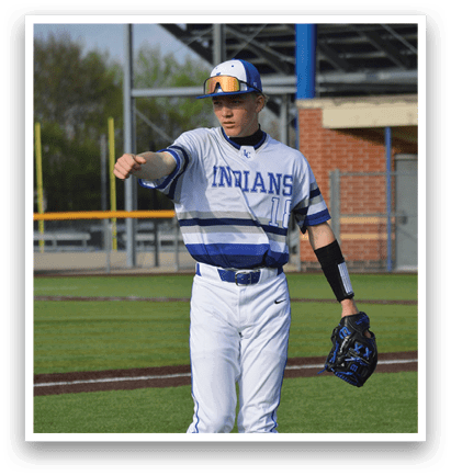 A baseball player wearing a blue and white uniform stands on a field holding a baseball glove. AI generated content
