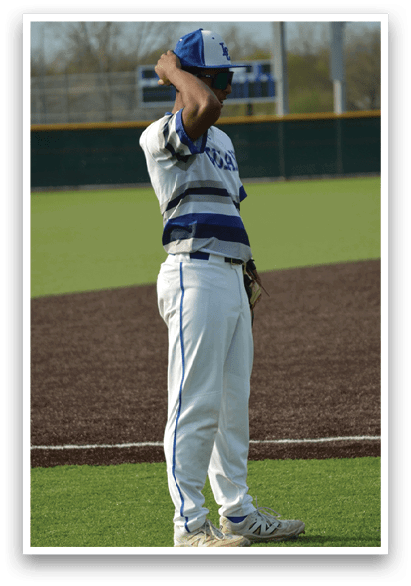 A baseball player wearing a blue hat and a white and blue striped shirt stands on a baseball field. AI generated content