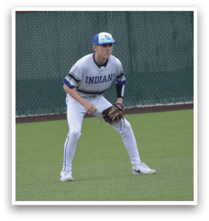 A baseball player is standing on the field, wearing a blue hat and a white shirt. He is holding a baseball glove, ready to catch the ball. AI generated content