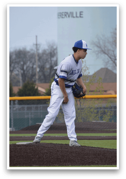 A baseball player in a blue and white uniform stands on a field, holding a baseball in his glove. AI generated content