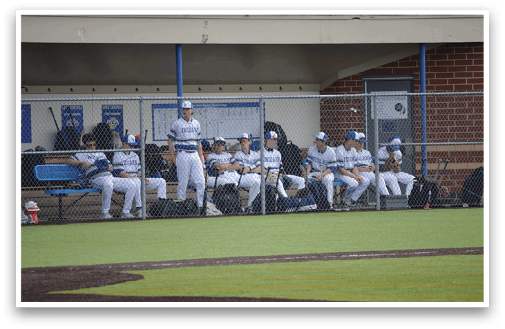 Baseball players sitting on bench in dugout. AI generated content