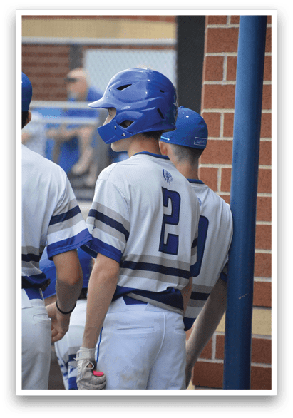 A baseball player wearing a helmet and uniform is standing next to another player. AI generated content