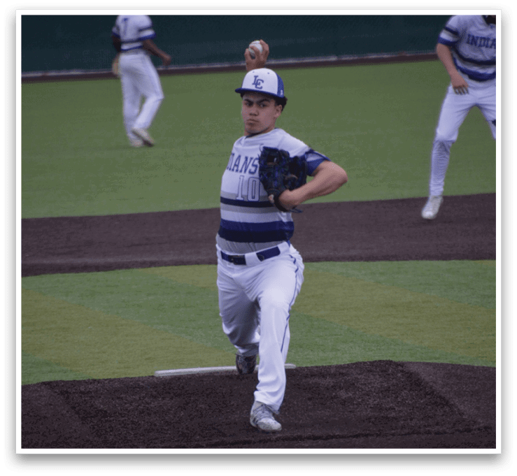 A baseball player in a white and blue uniform is pitching a ball on a field. AI generated content