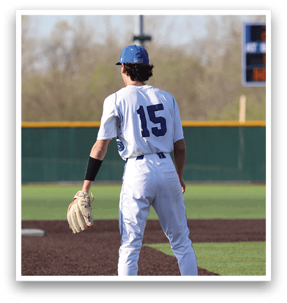 A baseball player wearing a blue cap and white uniform stands on the field, holding a mitt. AI generated content