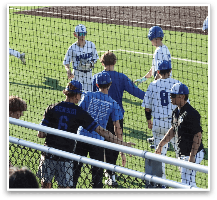 A group of young boys playing baseball on a field. AI generated content