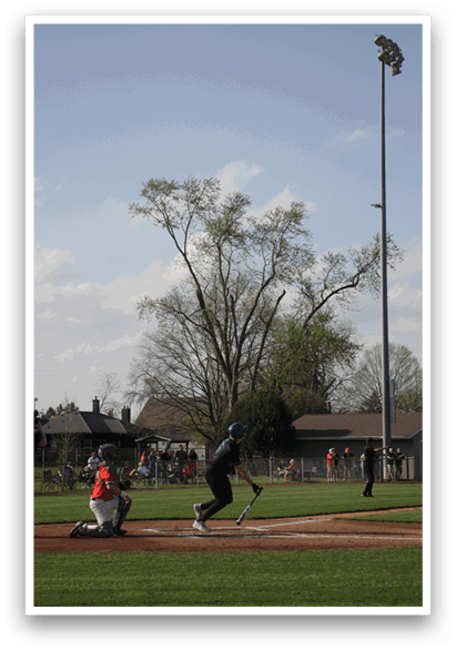 A baseball player is swinging a bat at a ball. AI generated content