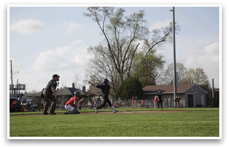 A baseball game is taking place on a field with a batter, catcher, and umpire. The batter is holding a baseball bat and preparing to swing. AI generated content