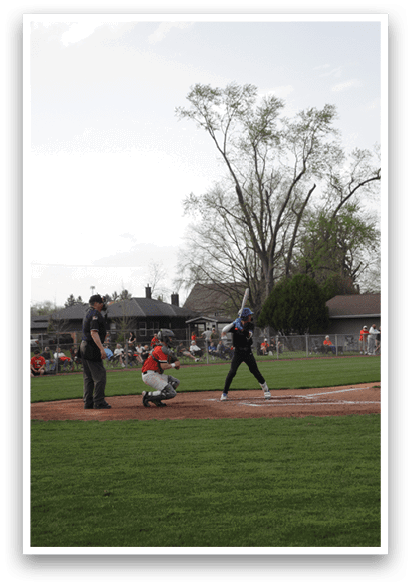 A baseball player is swinging a bat at a ball. AI generated content