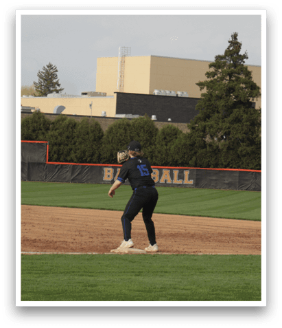 A baseball game is taking place on a field with a batter, catcher, and umpire. The batter is holding a baseball bat and preparing to swing at the ball. The catcher and umpire are positioned behind the batter, ready for the play. AI generated content