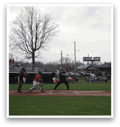 A baseball game is taking place with a batter swinging his bat at a ball. AI generated content