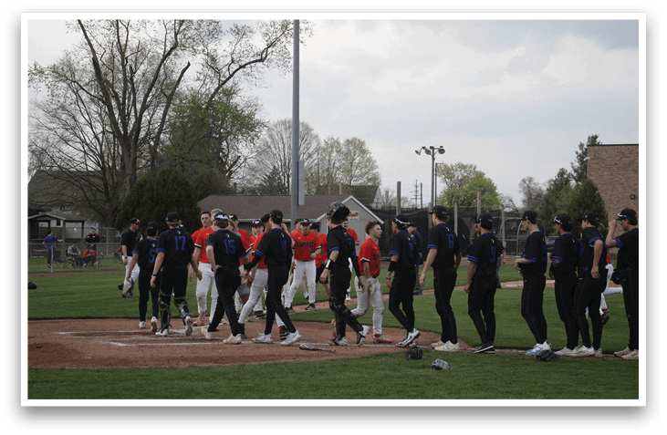 A group of baseball players are standing on a field, some wearing red and white uniforms, while others are in black. They are lined up, possibly for a game or practice. AI generated content
