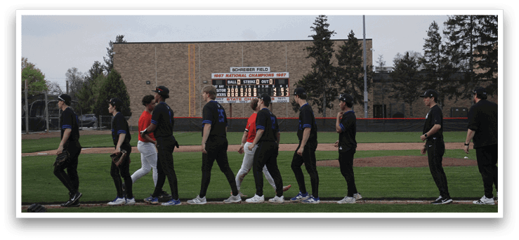 A group of baseball players wearing black uniforms are walking across a field. AI generated content