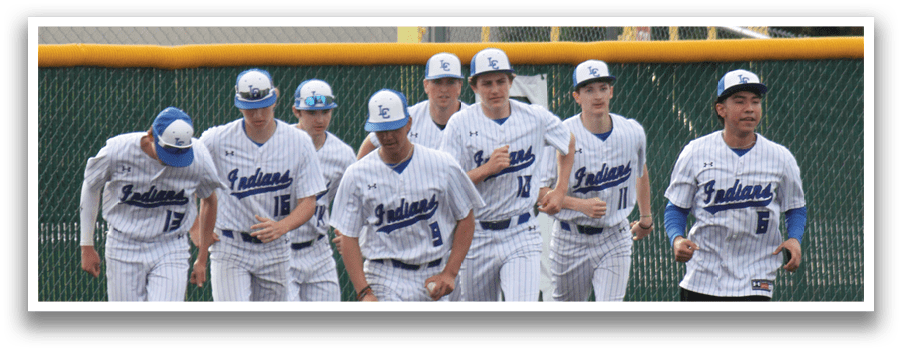 A group of baseball players wearing white uniforms and blue caps are walking across a field. AI generated content