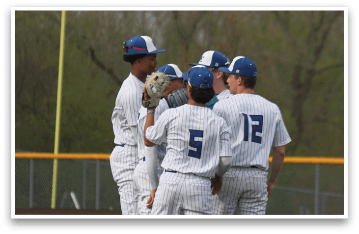 Baseball players wearing white uniforms and blue caps standing on a field. AI generated content