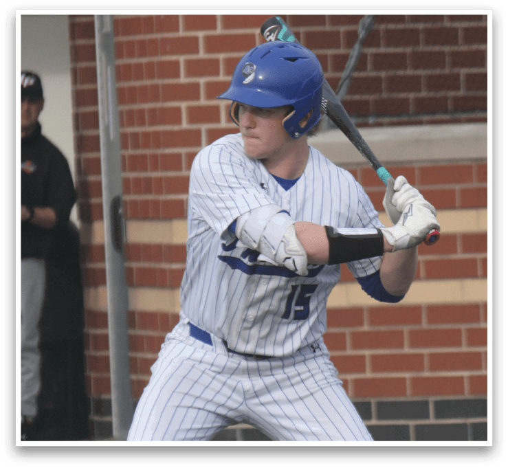 A baseball player in a white and blue uniform is swinging a bat, attempting to hit a ball. AI generated content