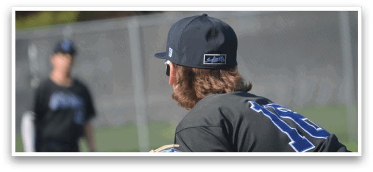 A man in a black baseball uniform is holding a baseball glove, preparing to catch a ball. AI generated content