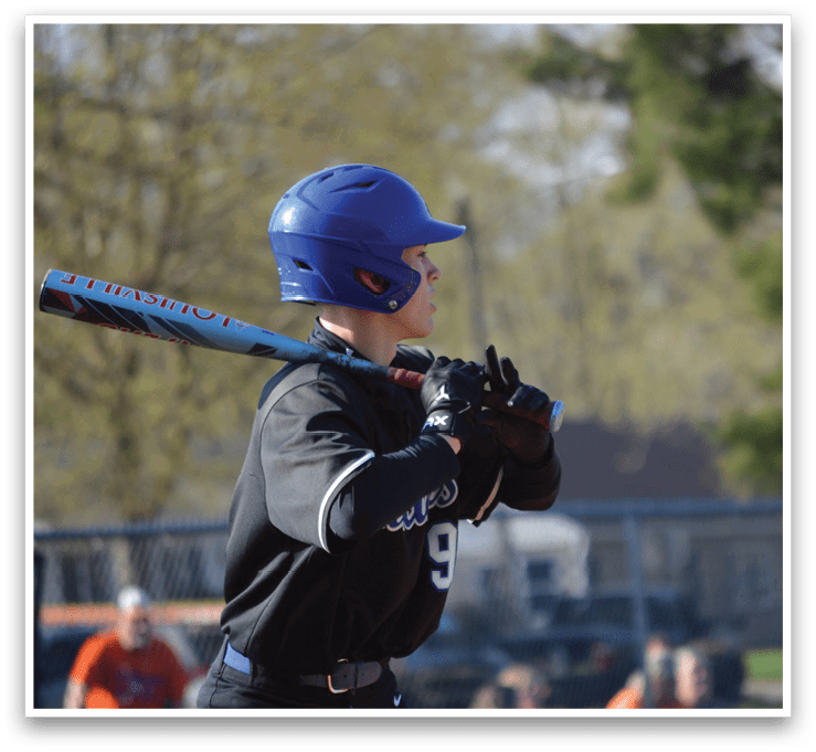 A baseball player in a blue helmet and black uniform is holding a bat, preparing to swing. AI generated content