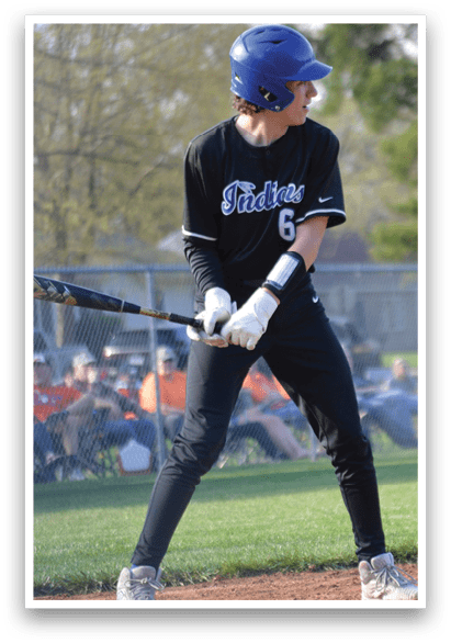 A baseball player in a black jersey is holding a bat, preparing to hit a ball. AI generated content