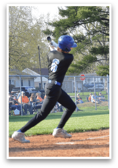 A baseball player in a black shirt and blue helmet is swinging a bat on a field. AI generated content