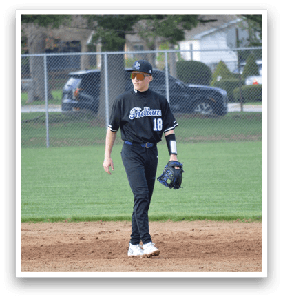 A baseball player wearing a black shirt and white shoes stands on a baseball field. AI generated content