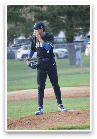 A baseball player in a black shirt and blue hat is pitching a ball on a field. AI generated content
