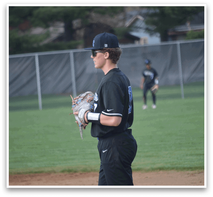 A baseball player wearing a black shirt and hat is holding a catcher's mitt. AI generated content