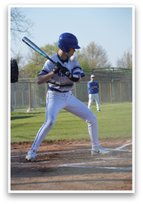 A baseball player in a white uniform is swinging a bat at a ball. AI generated content
