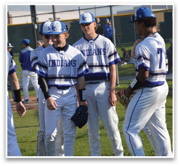A group of baseball players wearing blue and white uniforms are standing on a field. AI generated content