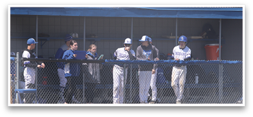 Baseball players in uniforms standing around a fence. AI generated content