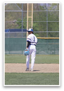 A baseball player in a white uniform stands on a field, holding a baseball glove. AI generated content