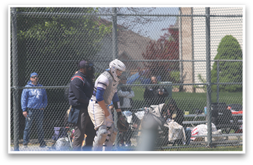 A baseball player wearing a helmet and white uniform is standing on a field. AI generated content
