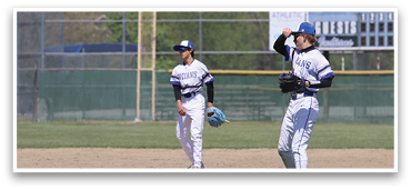 Two baseball players are standing on a field, one of them is holding a baseball glove. AI generated content