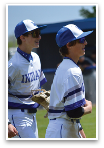 Two baseball players wearing blue and white uniforms are standing on a field. AI generated content