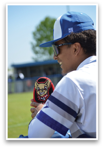 A young man wearing a white and blue shirt is holding a stuffed animal. AI generated content