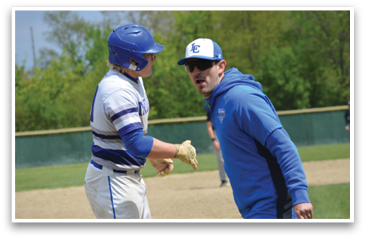 Two baseball players on a field, one wearing a blue jacket and the other wearing a white and blue striped shirt. AI generated content