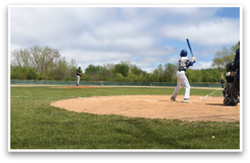 A baseball player is at bat, holding a bat and waiting for the pitch. AI generated content