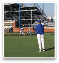 A baseball game is taking place with a man in a blue shirt and white pants standing on the field. AI generated content