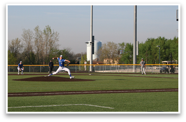 A baseball player in a blue shirt and white pants is throwing a ball on a field. AI generated content