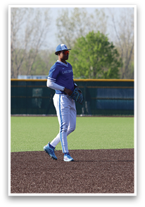 A baseball player wearing a blue shirt and white pants is walking on a field. AI generated content