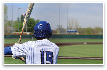 A baseball player in a blue and white uniform is holding a bat, getting ready to swing. AI generated content