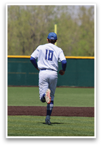 A baseball player wearing a blue cap and white uniform is running on the field. AI generated content