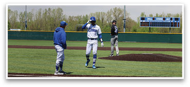 Three men are standing on a baseball field, with one of them waving. They are wearing baseball uniforms and are likely players. AI generated content