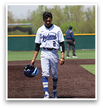 A baseball player wearing a blue and white uniform walks across the field. AI generated content