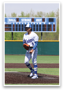 A baseball player in a blue and white uniform stands on the pitcher's mound, holding a baseball in his hand. AI generated content