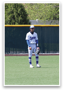 A baseball player stands in the outfield, wearing a white uniform and a blue hat. AI generated content