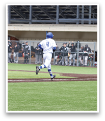 A baseball player is running towards home plate, wearing a blue helmet. AI generated content