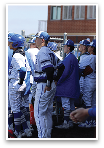 Baseball players wearing blue and white uniforms are standing together, some with their hands on their hips. AI generated content